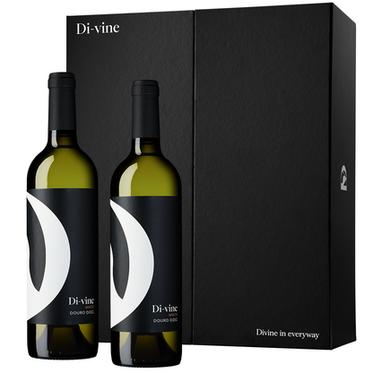 Front view of 2 bottles of "Di-vine" white wine in front of a black “Di-vine” elevator gift box on a white background.